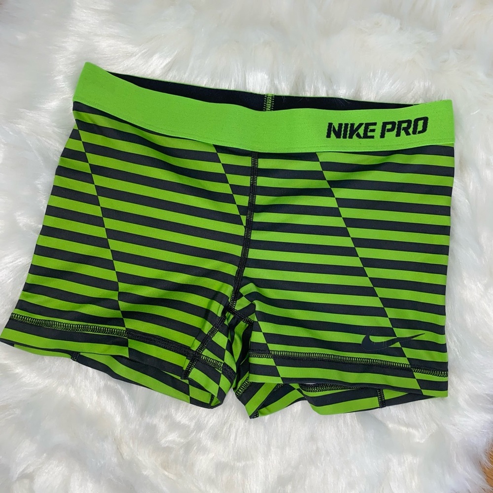 Green striped Nike shorts